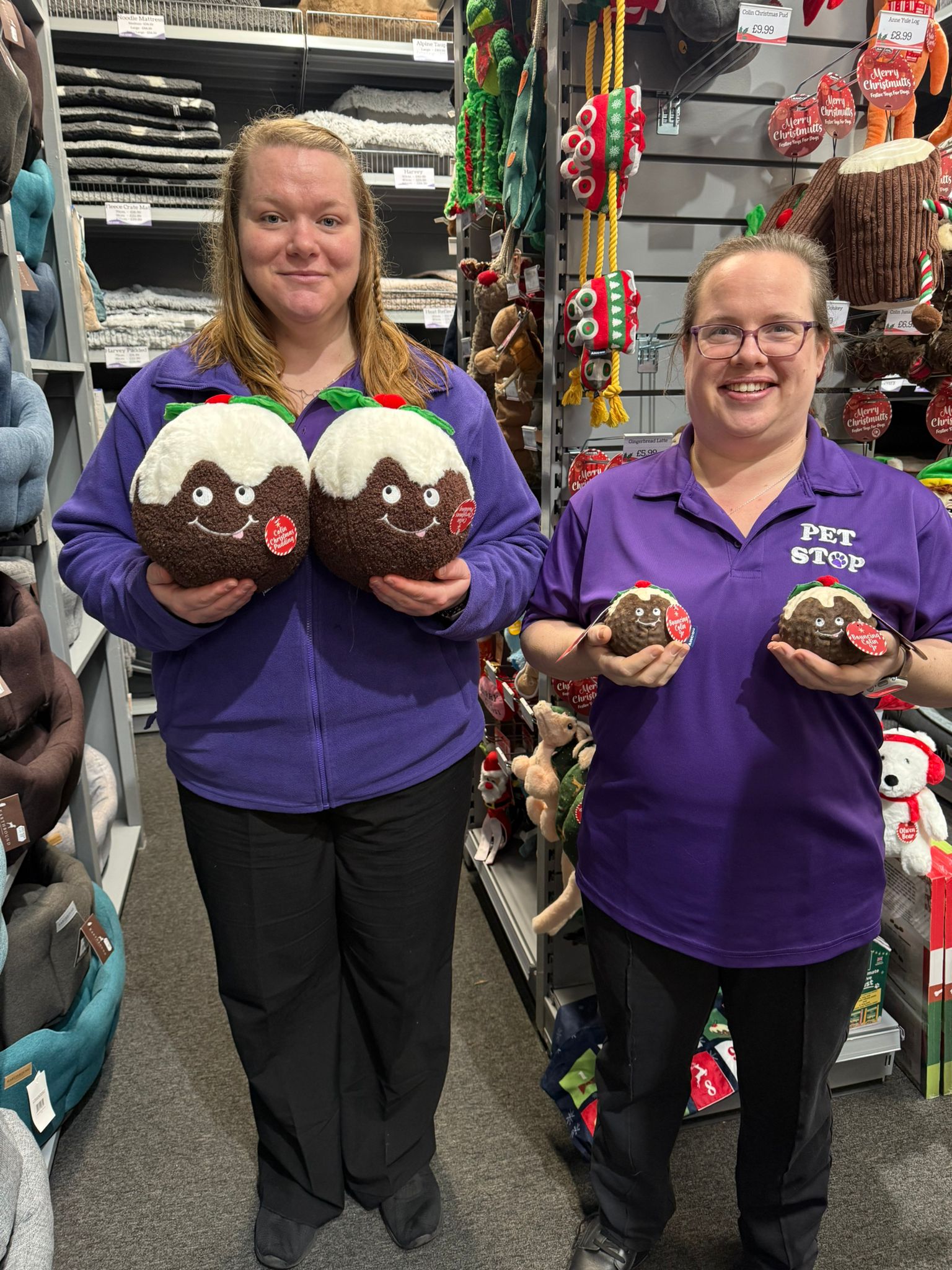 image of two woman holding up dog Christmas puddings
